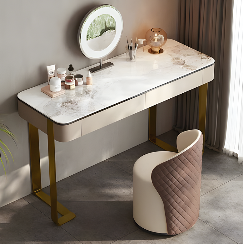 Dressing table with marble top and round mirror in a room with curtains.