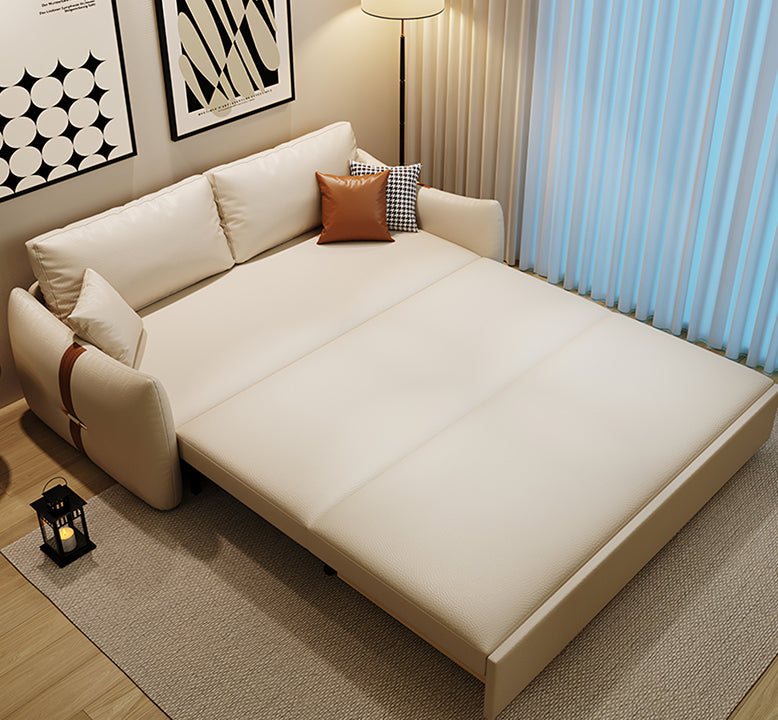 Beige sectional sofa with cushions in a living room setting.