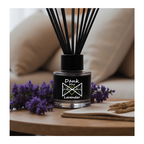 Black diffuser with lavender flowers on a wooden table