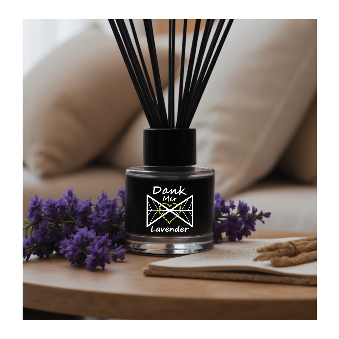 Black diffuser with lavender flowers on a wooden table