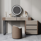 Modern vanity desk with round mirror and decorative items in a minimalistic room.
