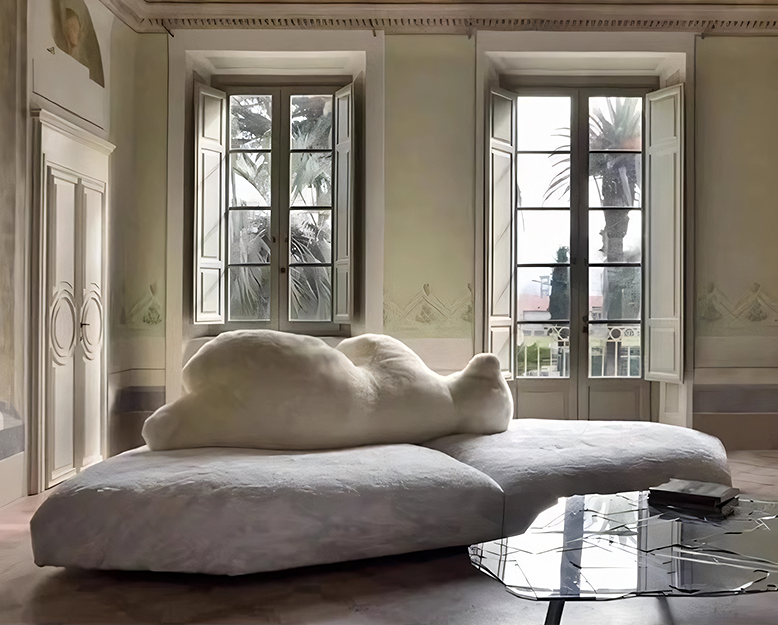 Modern living room with a unique cloud-shaped sofa and large windows.