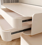 Modern white desk with pull-out drawers on a wooden floor.