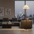 Modern living room with a sofa, coffee table, and floor lamp.
