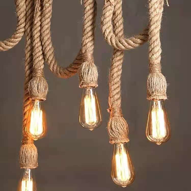 Vintage-style light fixture with braided rope and Edison bulbs on a dark background