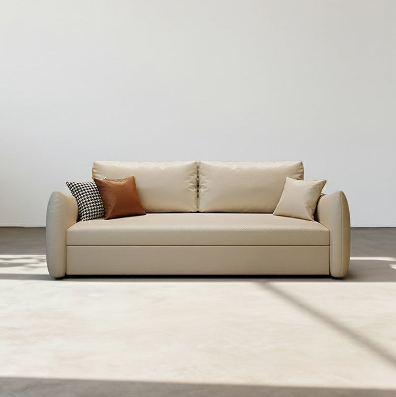 Beige sofa with decorative pillows on a white background