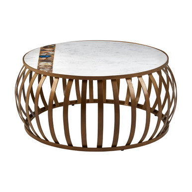 Coffee table with marble top and bronze metal base on a white background