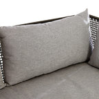 Gray cushions on a wicker chair with a white background