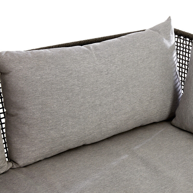 Gray cushions on a wicker chair with a white background