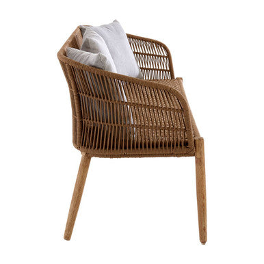 Woven chair with a white cushion on a white background