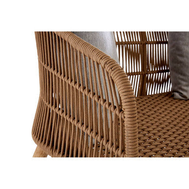 Close-up of a woven chair with a neutral background