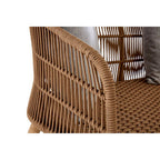 Close-up of a woven chair with a neutral background