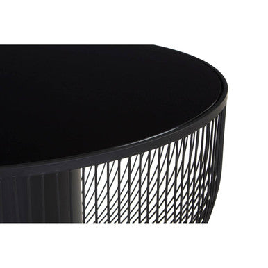 Black round table with textured metal base on a white background