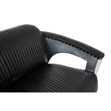 Black office chair with ribbed design on a white background