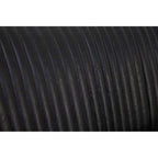 Close-up of black textured fabric with a white background