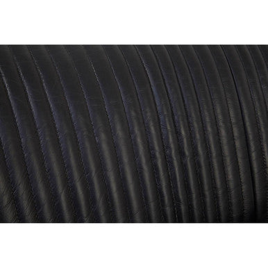 Close-up of black textured fabric with a white background