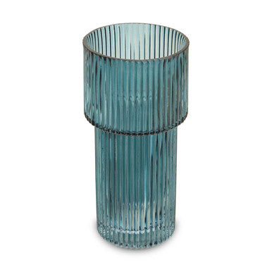 Blue ribbed glass vase on a white background