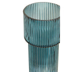 Teal glass vase with ribbed design on a white background