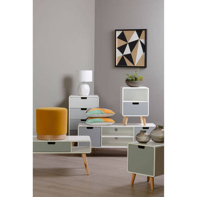 Modern furniture set with side tables, a cabinet, and decorative items in a room.