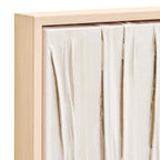 Wooden frame with white fabric draped over it