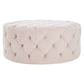 Pink tufted ottoman on a white background
