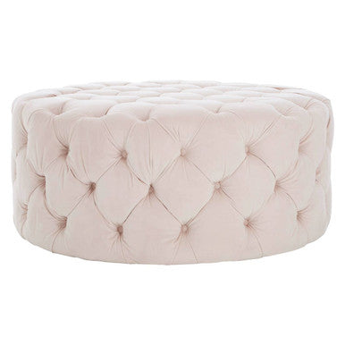 Pink tufted ottoman on a white background