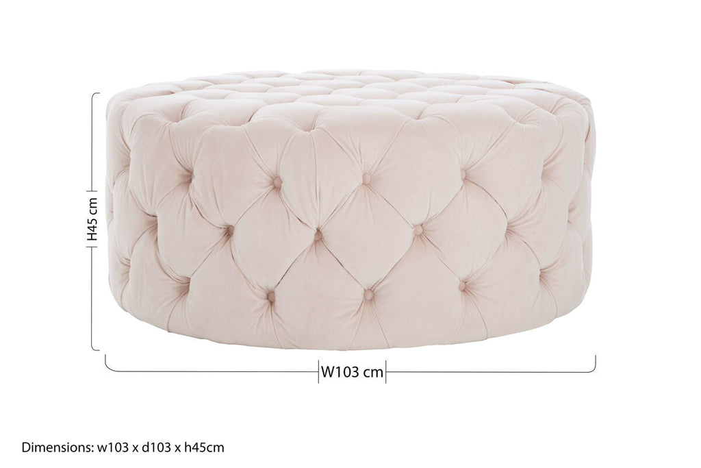 Pink tufted ottoman with dimensions on a white background