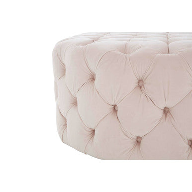 Round tufted ottoman with a soft pink color on a white background