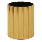 Gold metallic side table with a black top on a white background