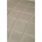 Close-up of beige tiles with a subtle pattern on a white background