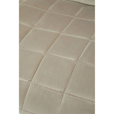 Close-up of beige tiles with a subtle pattern on a white background