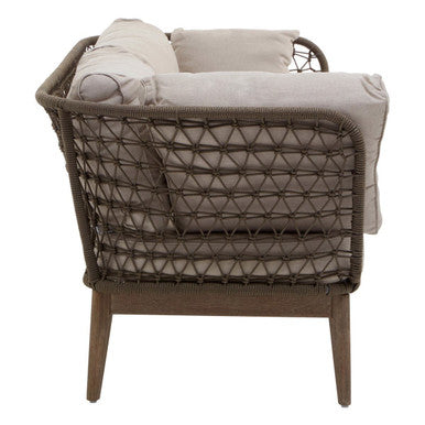 Wicker chair with woven backrest and beige cushions on a white background
