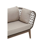 Outdoor sofa with beige cushions on a white background