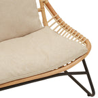 Beige cushioned chair with wicker frame on a white background