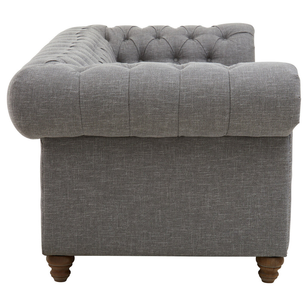 Gray tufted armchair with wooden legs on a white background