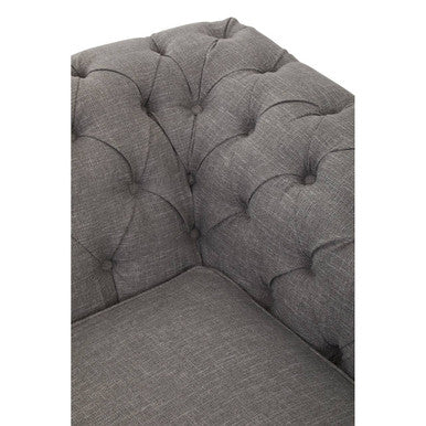 Gray tufted corner sofa on a white background