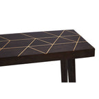 Black table with gold geometric patterns on a white background