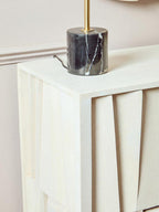 Decorative lamp with marble base on a white surface