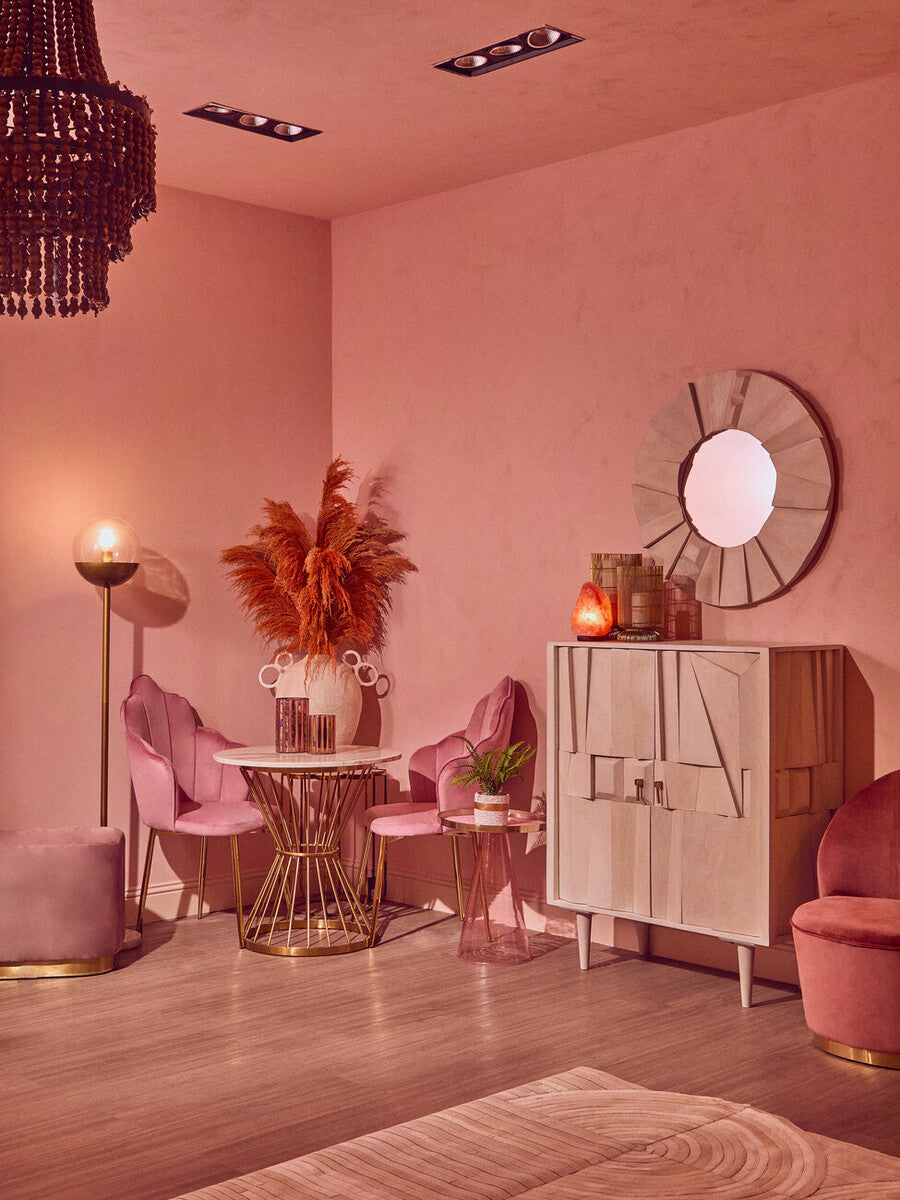 Pink interior design with furniture and decorative elements
