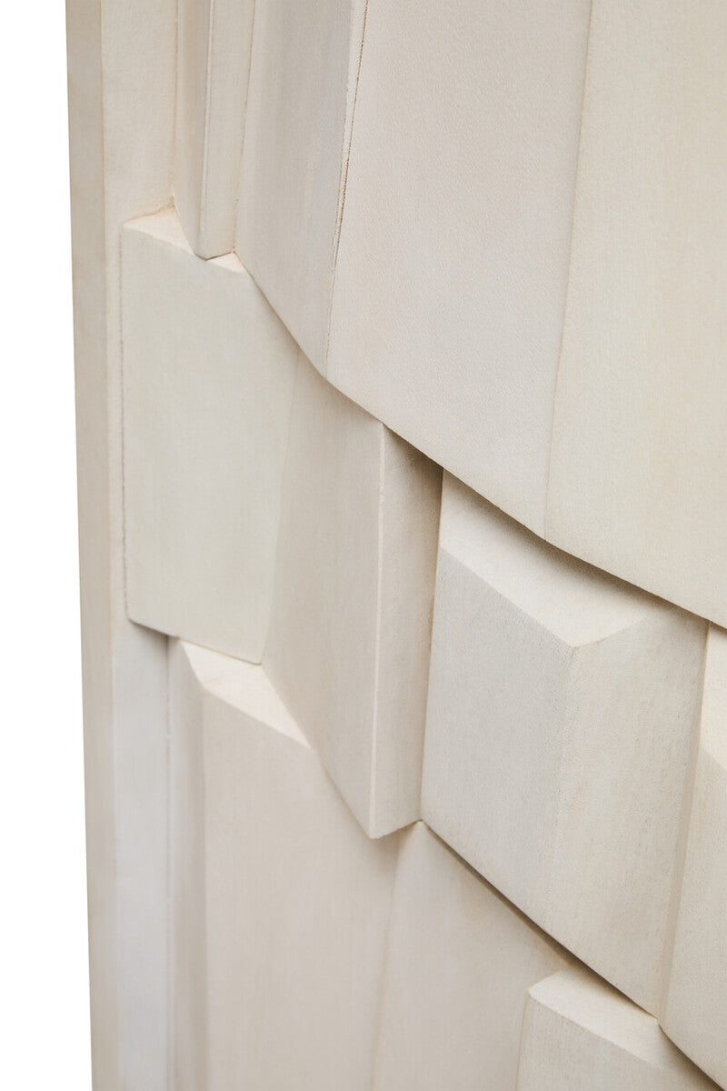 Close-up of a textured white surface with layered panels