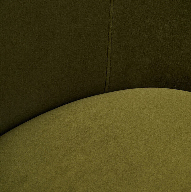 Close-up of a green upholstered chair with a focus on texture and color.