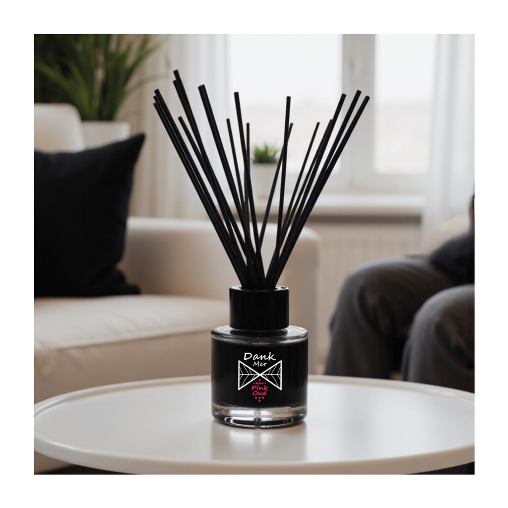 Diffuser with black sticks on a table in a living room setting