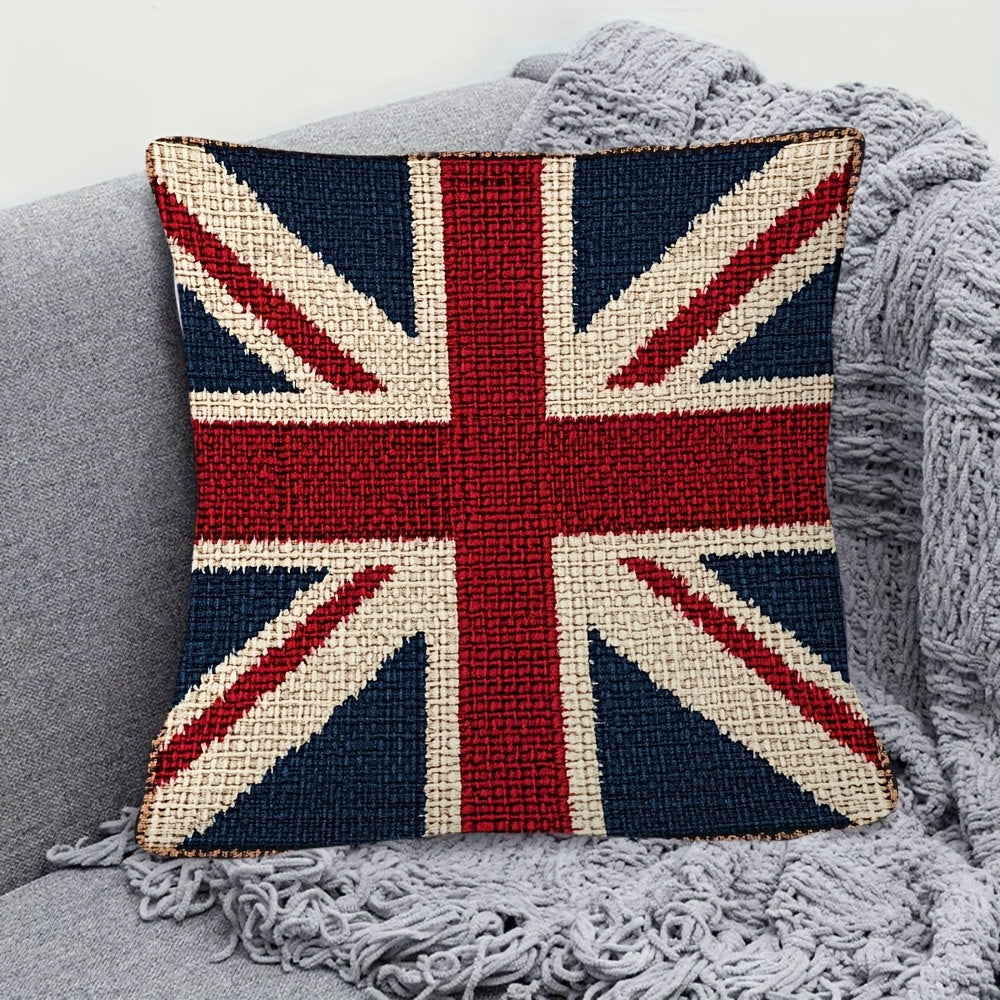 Union Jack pillow on a gray couch with a textured blanket