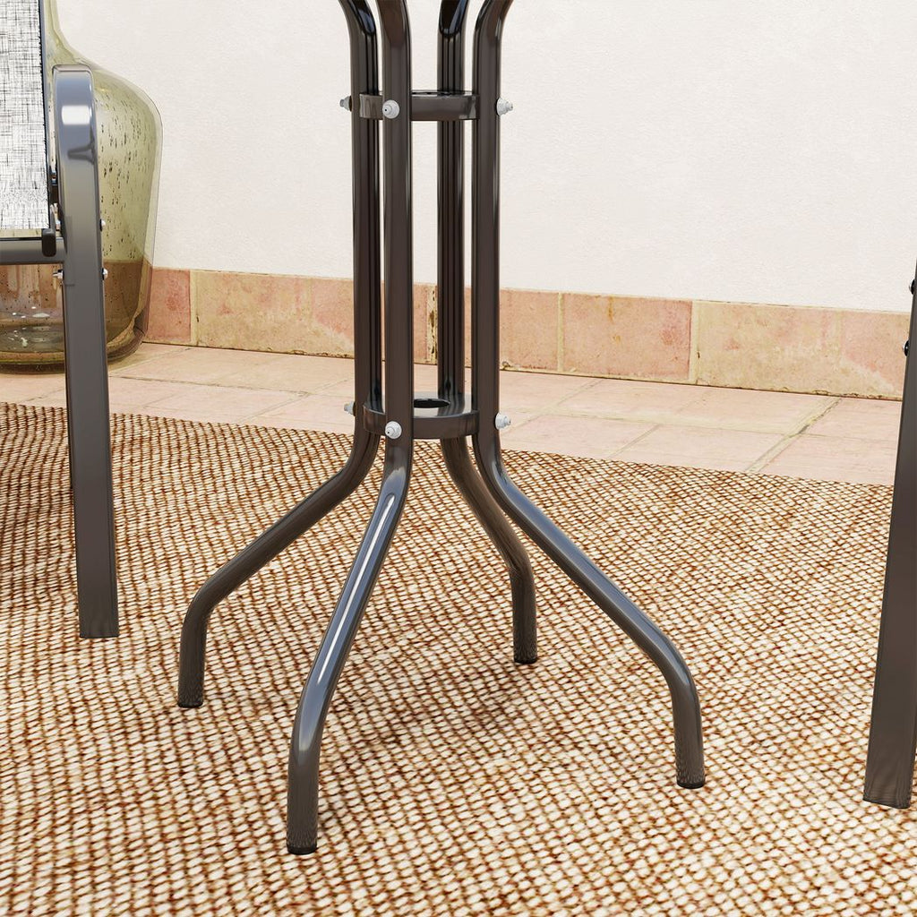 Black metal stand on a textured floor with a neutral wall background