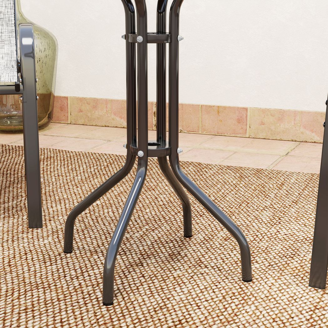 Black metal stand on a textured floor with a neutral wall background