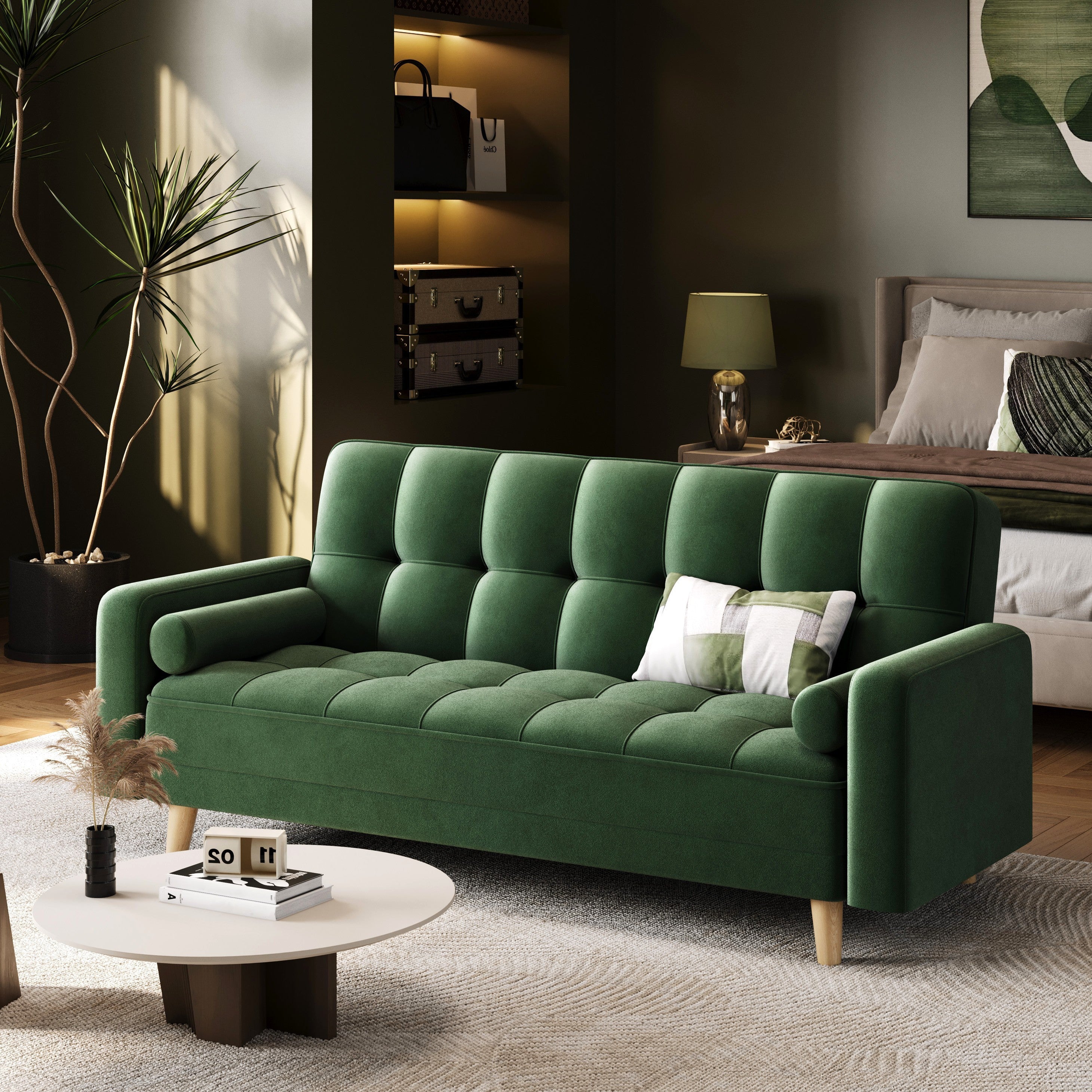 Green sofa in a living room setting with decor elements.