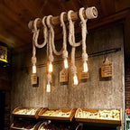 Rustic pendant light with hanging signs in a bakery setting