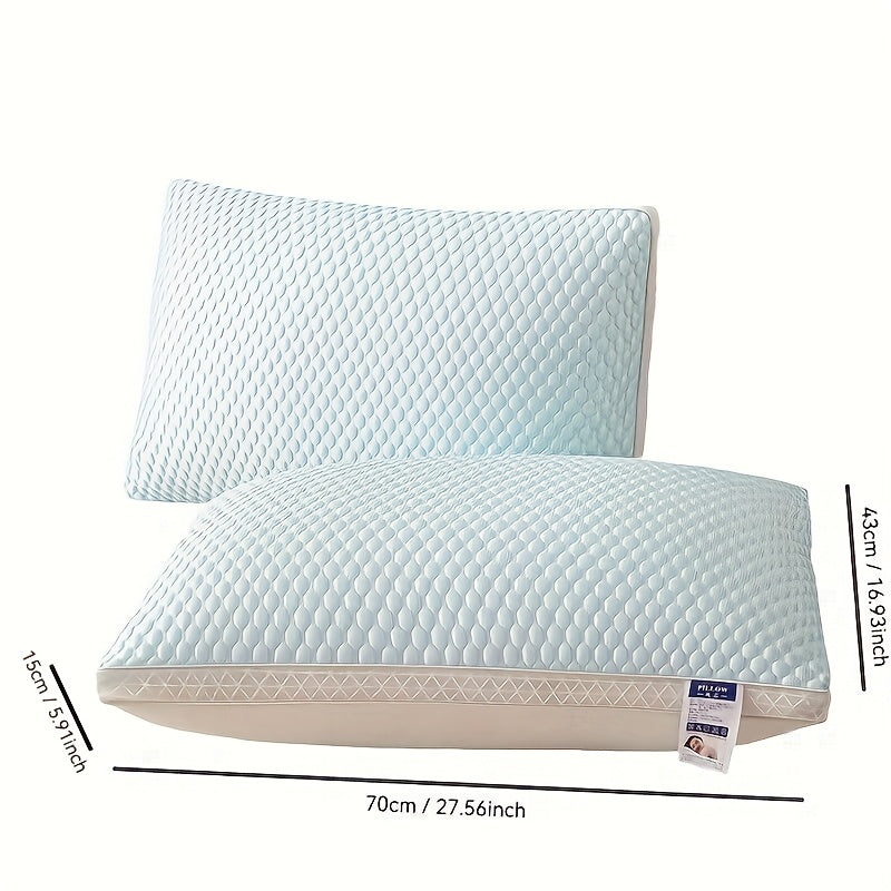 Two light blue pillows with measurements on a white background