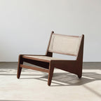 Wooden chair with woven backrest on a light background