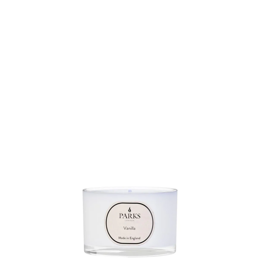 Clear glass candle with 'Parks' branding on a white background